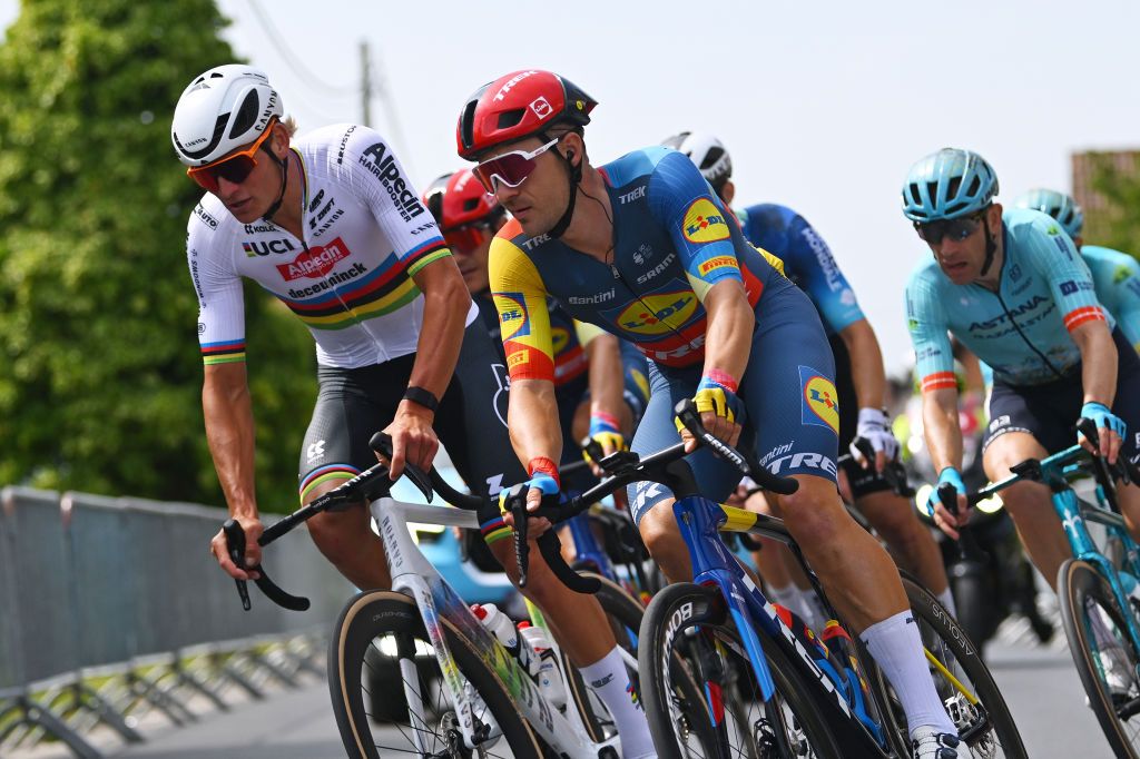 ARDOOIE BELGIUM AUGUST 30 LR Mathieu Van Der Poel of The Netherlands and Team Alpecin Deceuninck and Edward Theuns of Belgium and Team Lidl Trek compete during the 20th Renewi Tour 2024 Stage 3 a 1855km stage from Blankenberge to Ardooie UCIWT on August 30 2024 in Ardooie Belgium Photo by Luc ClaessenGetty Images