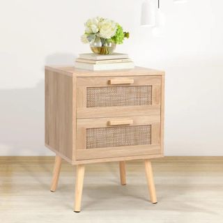 A wood and rattan side table with two drawers