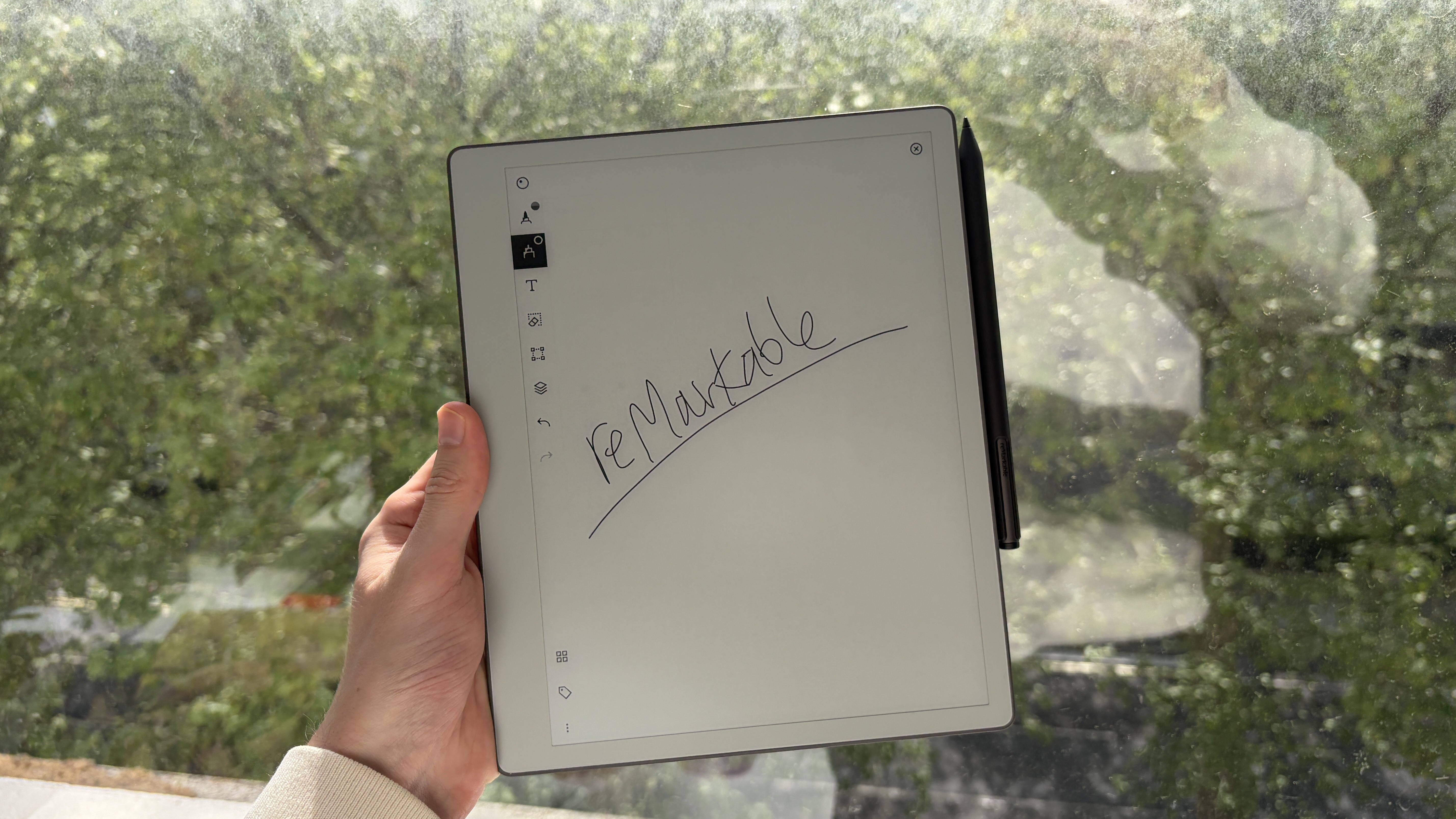 The reMarkable Paper Pure being held in the hand