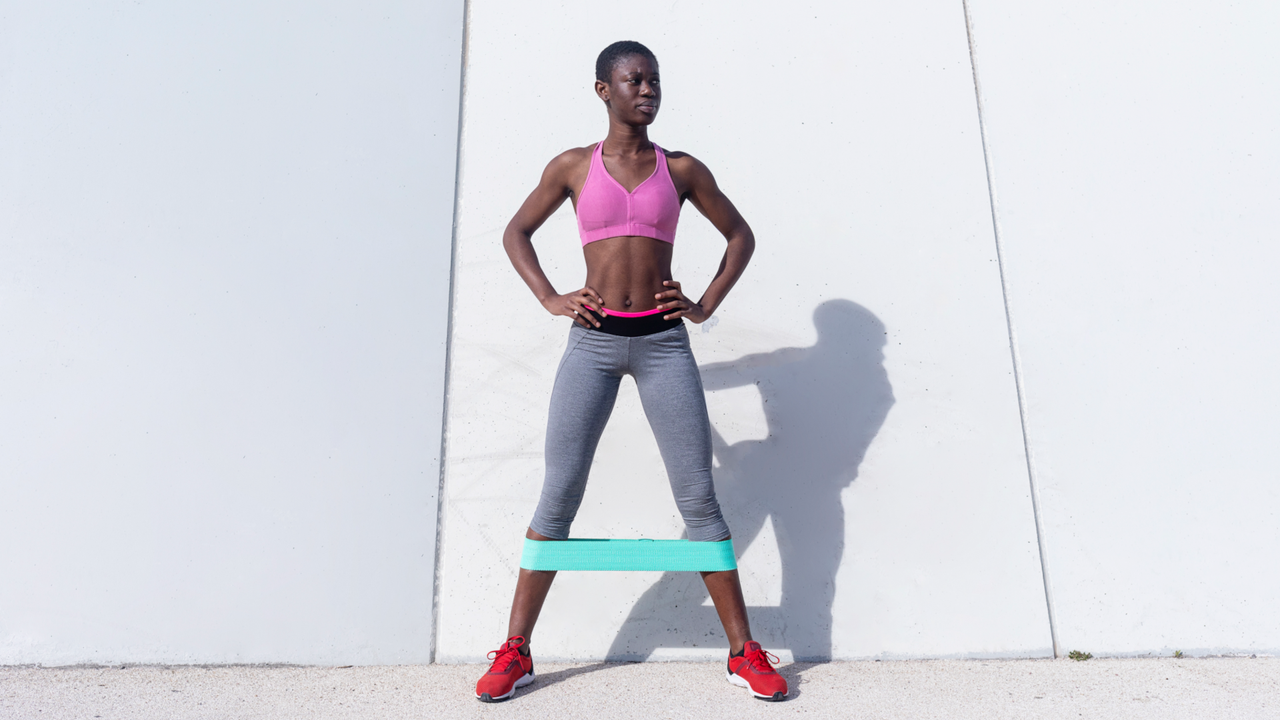 Woman doing resistance band leg workout