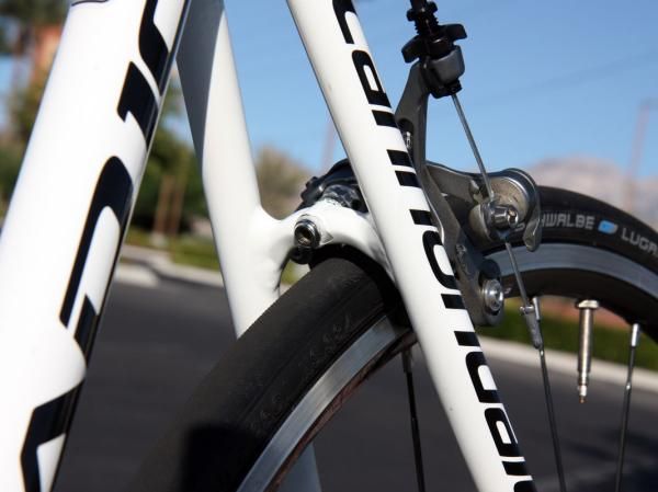The brake bridge is hollow-forged to save a few grams.