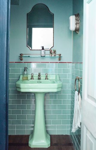 Small blue bathroom with blue sink