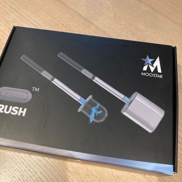 The Moostar Silicone Head Stainless Steel Toilet Push Brush pictured in the tester's home before unboxing.