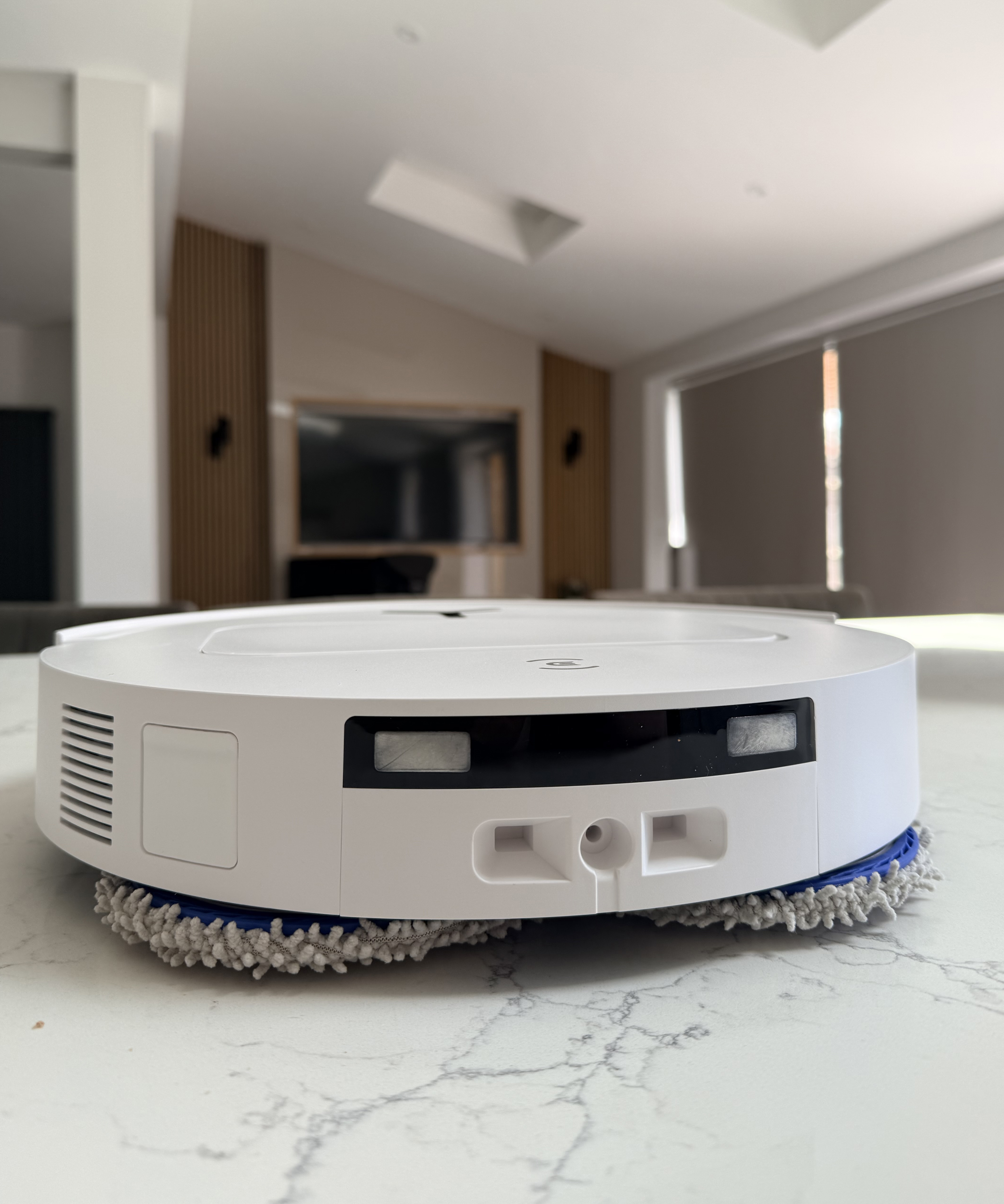 Front view of the Ecovacs Deebot T50 Pro Omni robot vacuum showing the front camera and obstacle detection sensors