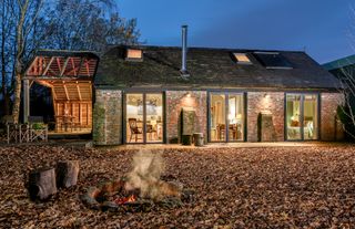 Eco barn in East Sussex lit up at night