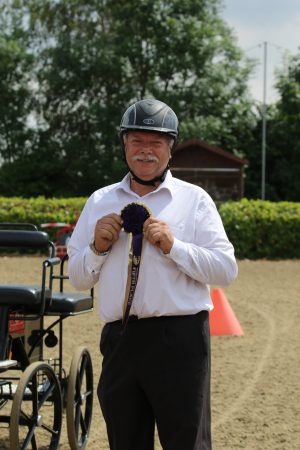 Dad with his rosette for cones driving