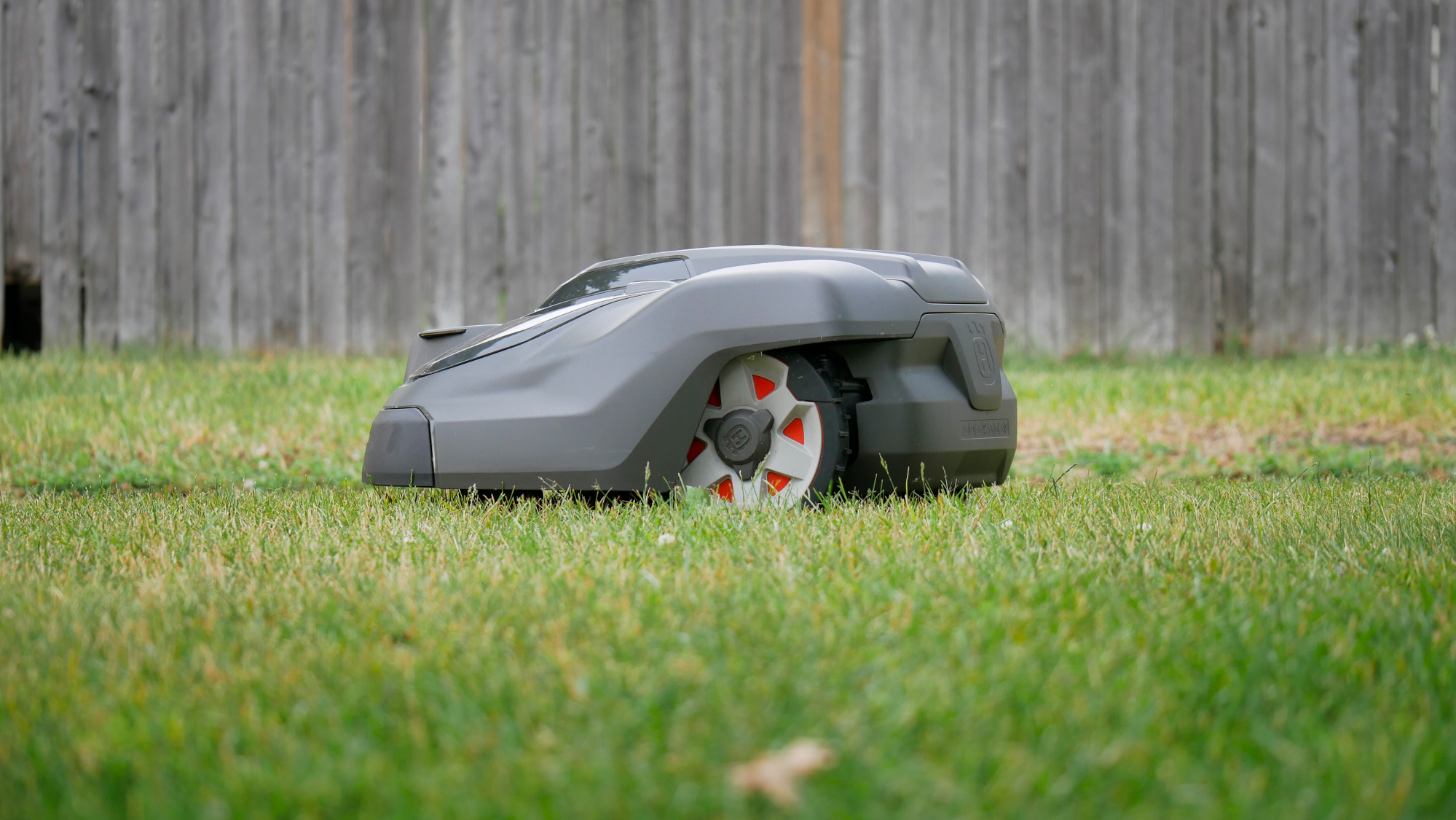 Husqvarna Automower 450XH EPOS robotic lawn mower cutting lawn.