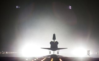 Xenon lights help lead space shuttle Endeavour home to NASA's Kennedy Space Center in Florida.