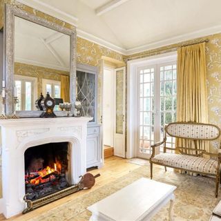 living room with fire place and wallpaper
