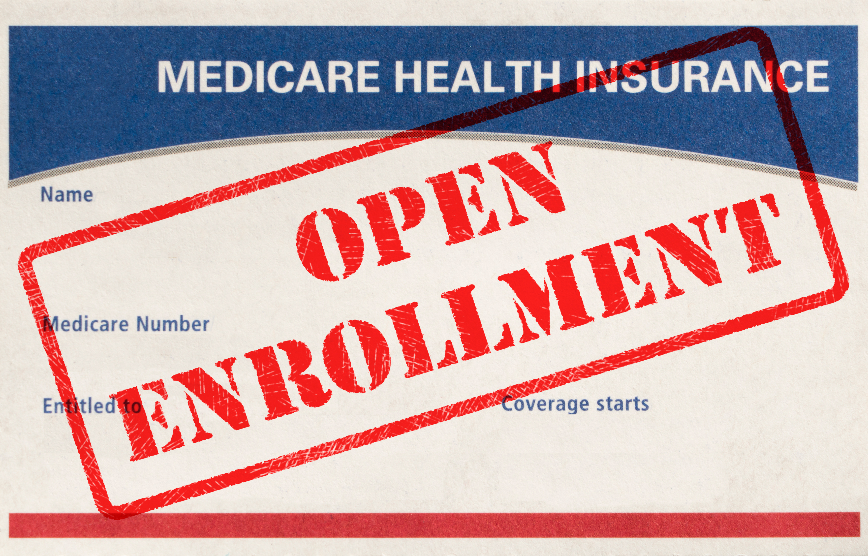 Medicare card with open enrollment across it