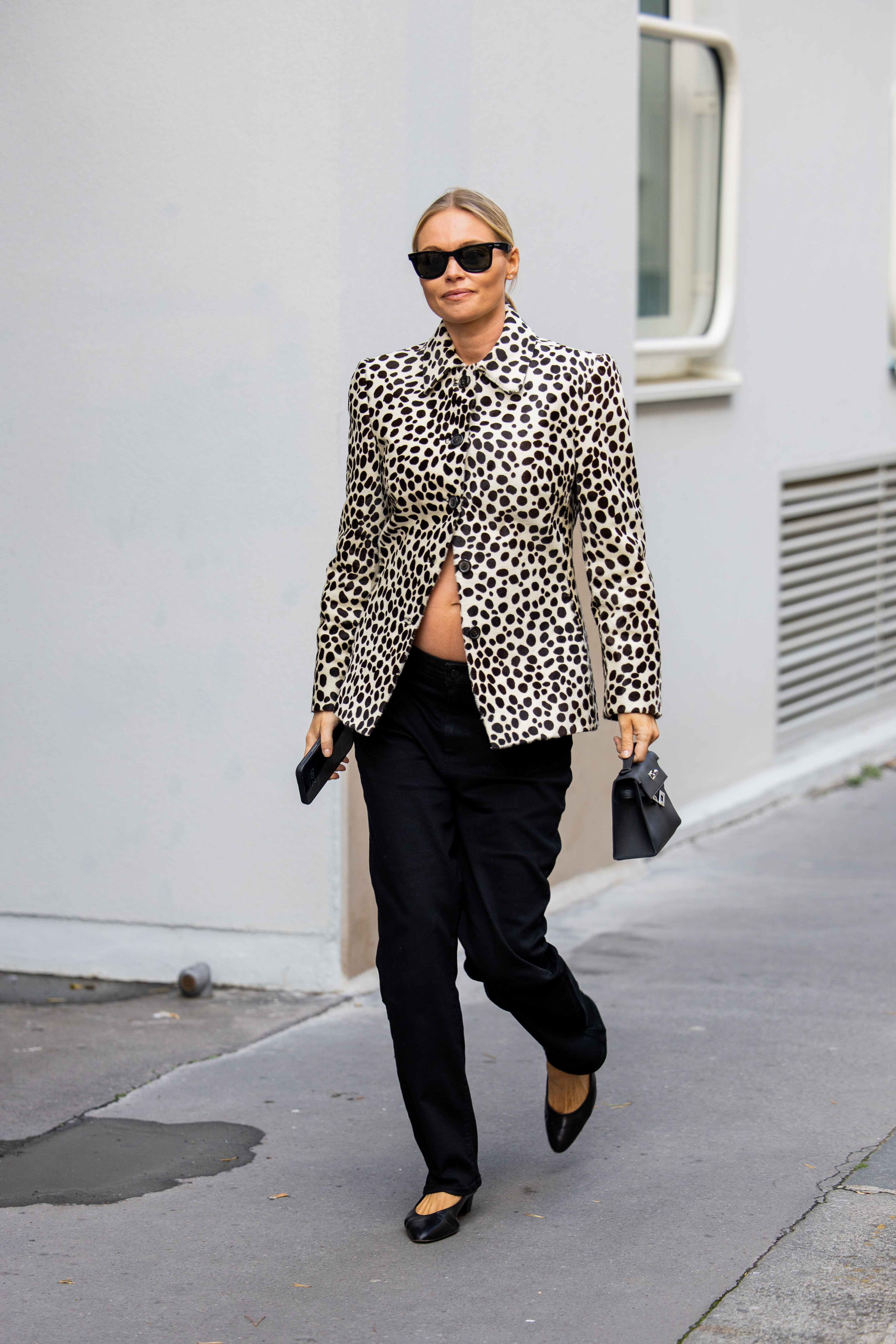 PARIS, FRANCE - OCTOBER 04: Claire Rose Cliteur wears dots print jacket, black pants, bag outside Hermes during the Womenswear Spring Summer 2026 as part of Paris Fashion Week on October 04, 2025 in Paris, France. (Photo by Christian Vierig/Getty Images)