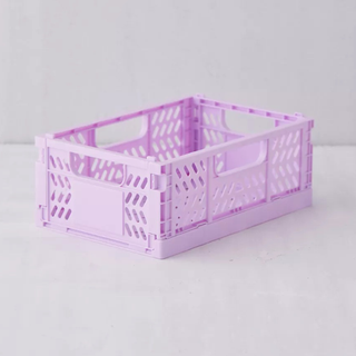 A lavender foldable plastic storage crate