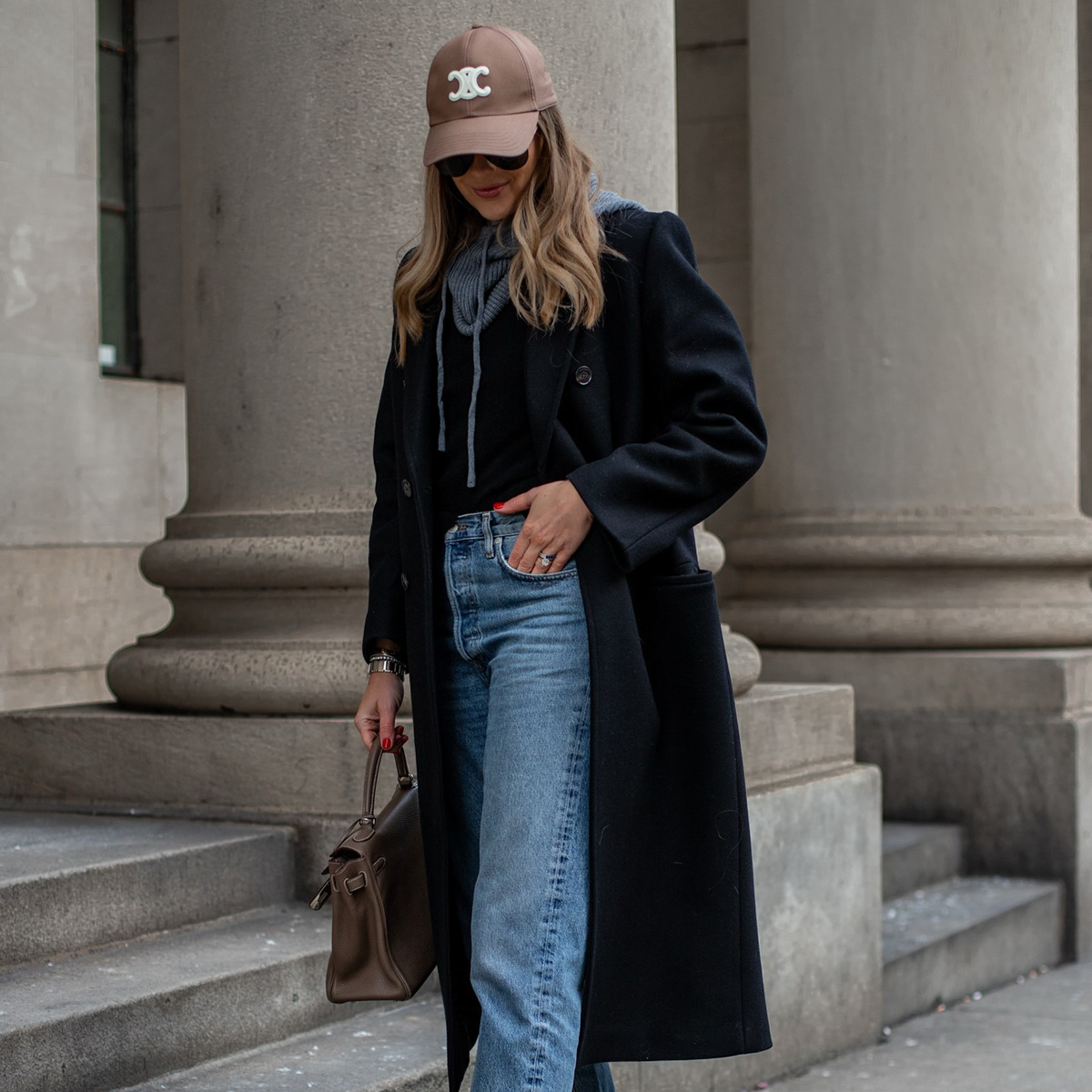 amy jackson wearing jeans and a baseball cap
