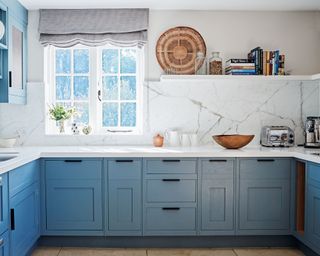 blue kitchen with lower cabinets and open shelves