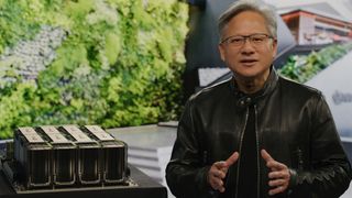 Nvidia CEO Jensen Huang speaking in front of a workstation GPU