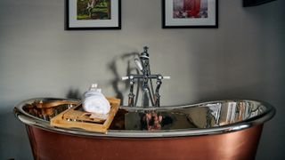 Bathroom with a copper tub