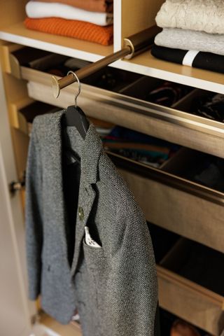 a valet rod in a closet
