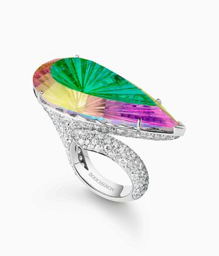 Ring in rainbow precious stones on a daimond mount