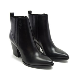 A pair of black leather boots with pointed toes and fitted ankle