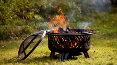 A fire pit on a lawn 