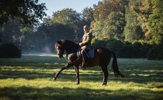 Axel Vervoordt riding his stallion Raio in the grounds of his estate outside Antwerp