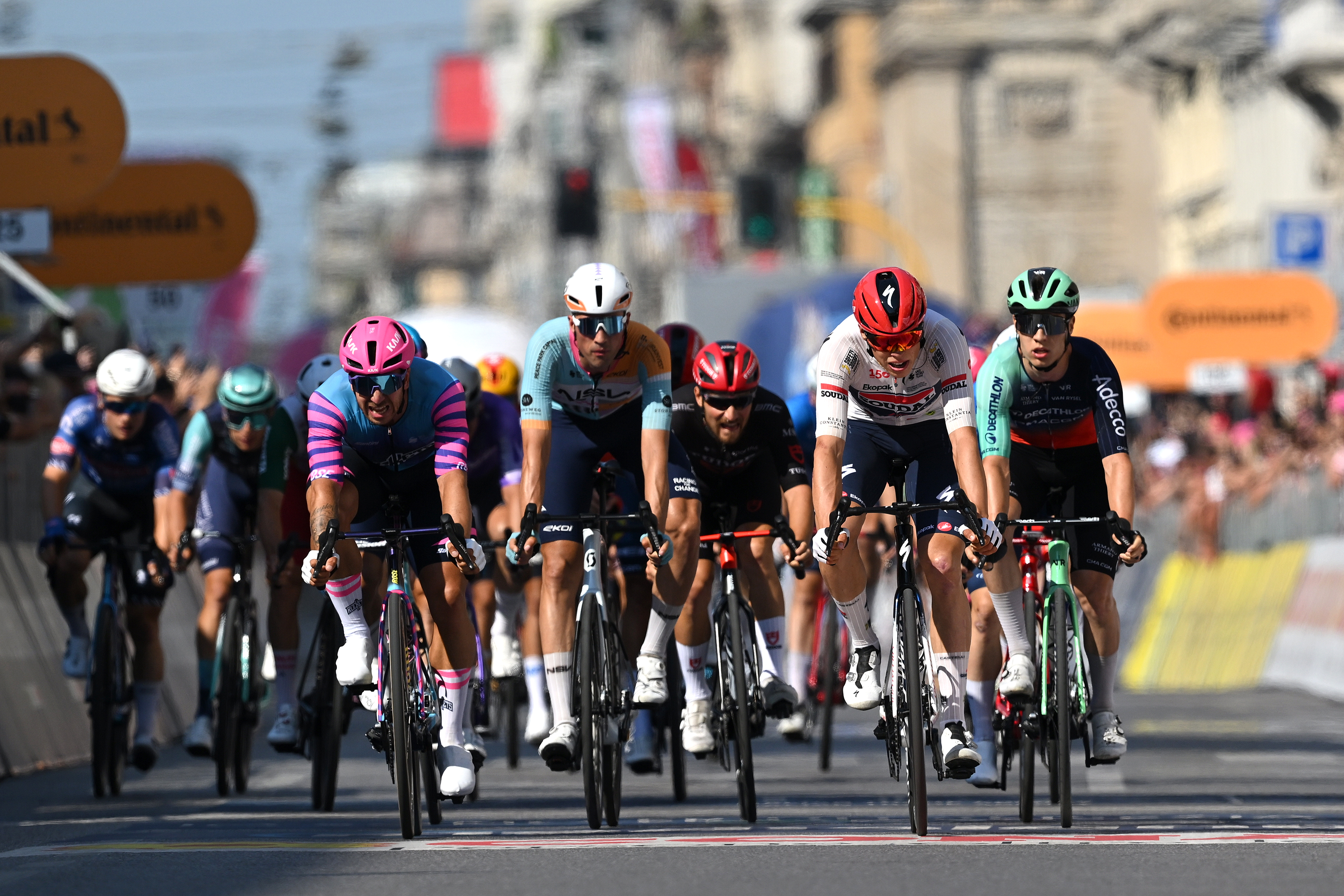 MILAN, ITALY - MAY 24: (L-R) Dylan Groenewegen of Netherlands and Team Unibet Rose Rockets, Ethan Vernon of Great Britain and Team NSN Cycling, Paul Magnier of France and Team Soudal Quick-Step and Tobias Lund Andresen of Denmark and Team Decathlon CMA CGM cross the finish line during the 109th Giro d&amp;amp;apos;Italia 2026, Stage 15 a 157km stage from Voghera to Milan / #UCIWT / on May 24, 2026 in Milan, Italy. (Photo by Tim de Waele/Getty Images)