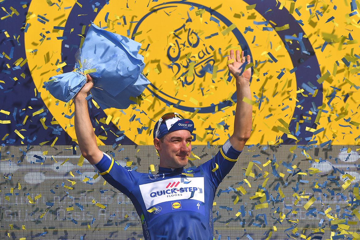 Elia Viviani has a surprise visit to the podium to take the race leader's jersey