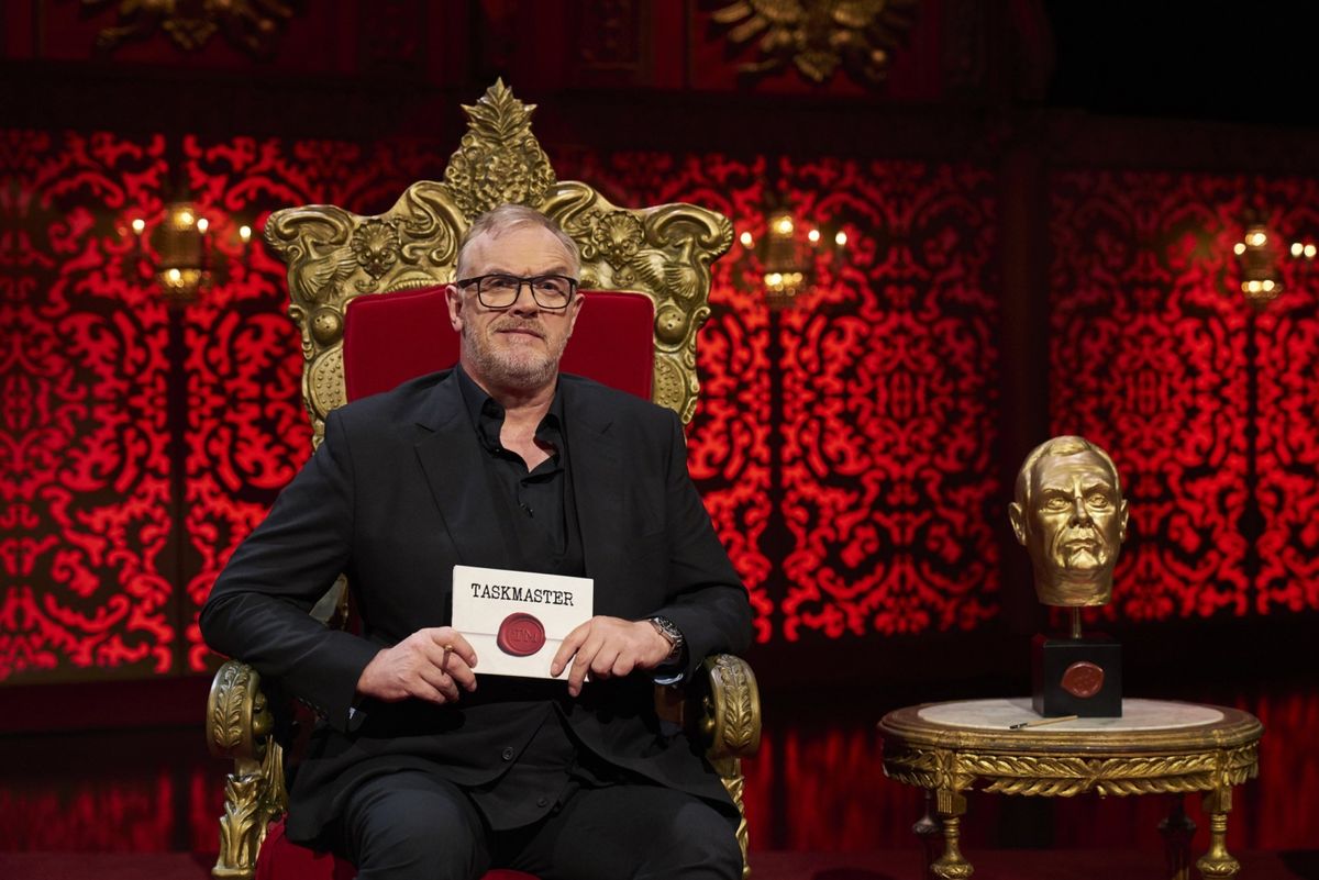 greg davies the taskmaster with golden taskmaster trophy