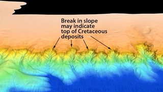 Researchers think these undersea cliffs may hold geological clues to the dinosaurs' demise. This close-up image of the Campeche Escarpment from the 2013 sonar survey shows the proposed contact between rocks of Cretaceous age (below) and younger rocks (above).