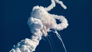 plume of smoke and debris from an in-flight vehicle explosion