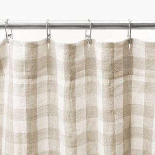 neutral checkered shower curtain on silver rail