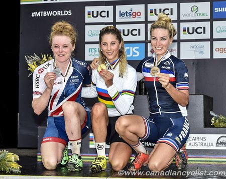 Annie Last of Great Britain and Pauline Ferrand Prevot of France with new world champion Jolanda Neff of Switzerland