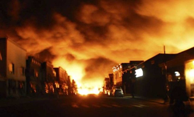 Fire from a train explosion is seen in Lac Megantic, Canada on July 6. The death toll may rise to 50.