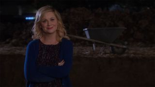 Leslie Knope (Amy Poehler) in the pit smirking in Parks and Recreation
