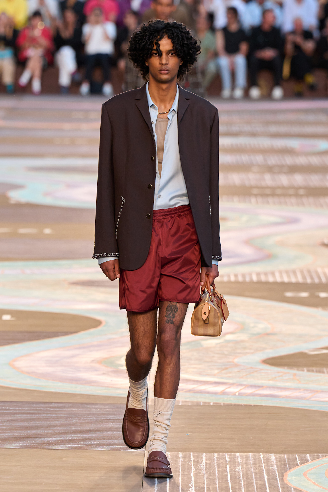 A model wears the Beyoncé-approved duffle bag on the Louis Vuitton Spring/Summer 2026 runway.