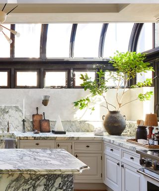 A marble kitchen with large arched skylights