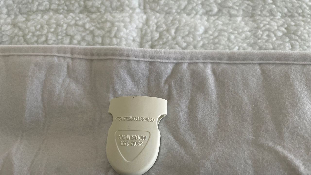 The part of the Dreamland Hunker Down Mattress Warmer where the remotes detatch for washing the mattress warmer