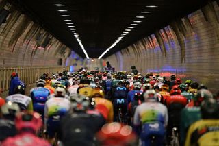 The pack of riders cycle through the Waaslandtunnel at the start of the mens race of the Ronde van Vlaanderen Tour des Flandres Tour of Flanders one day cycling event 2725km from Antwerp to Oudenaarde on April 3 2022