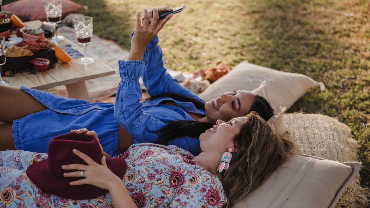 women taking a selfie in the park - stock photo