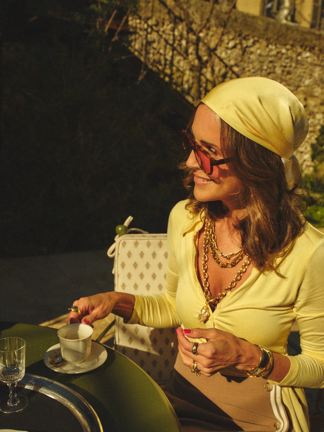 Larissa Mills wearing a silk scarf around her neck