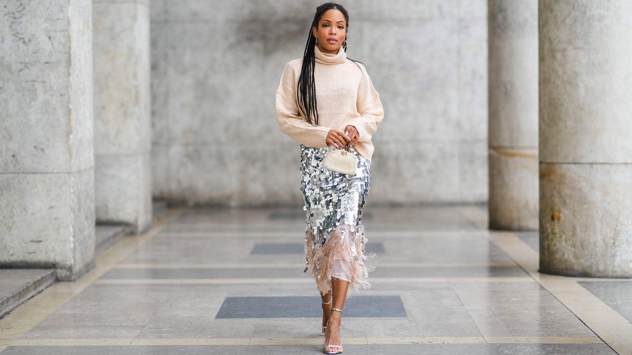 woman wearing sparkly skirt for new year&#039;s eve party