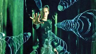 Neo (Keanu Reeves) stops bullets in &quot;The Matrix&quot;