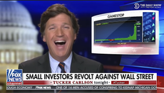 Tucker Carlson laughs
