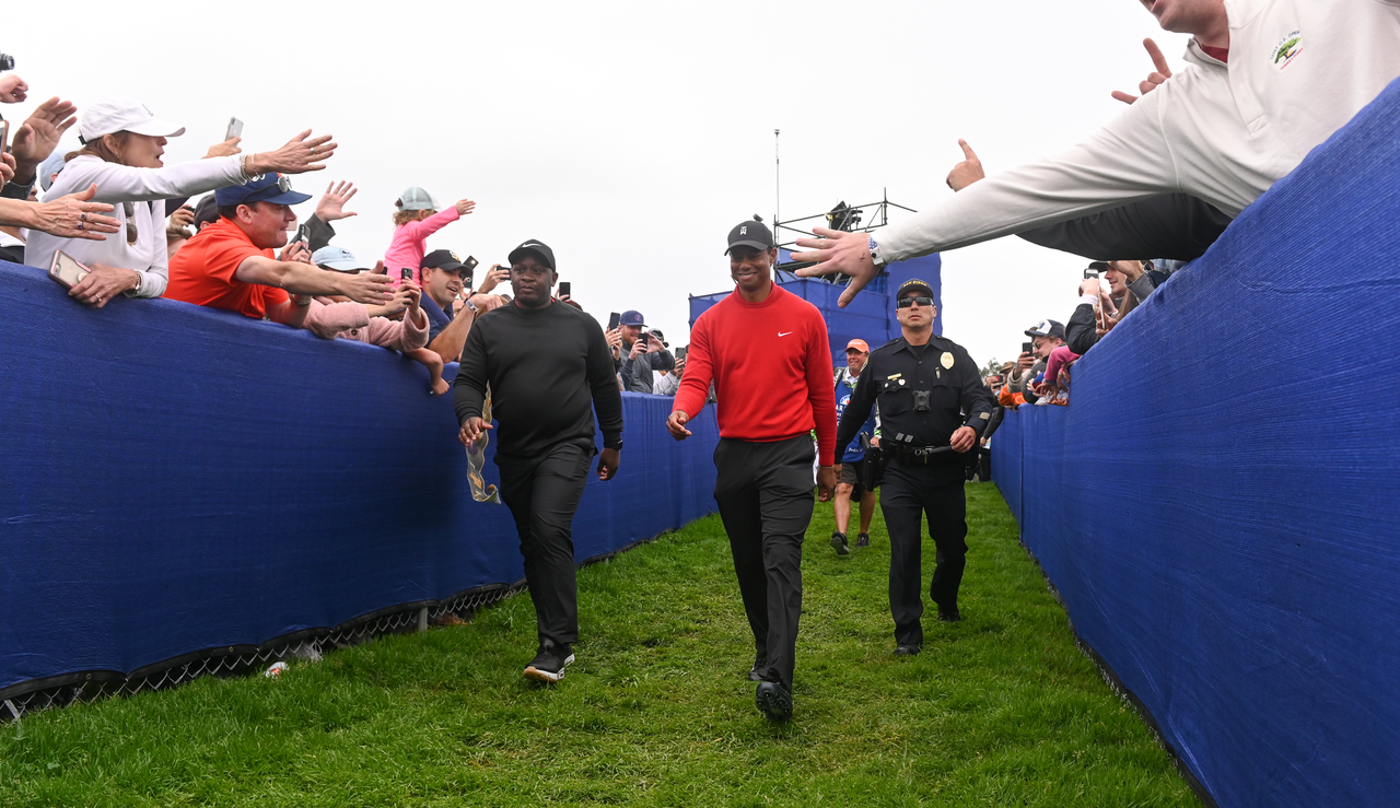 Tiger Woods walks through fans at Torrey Pines