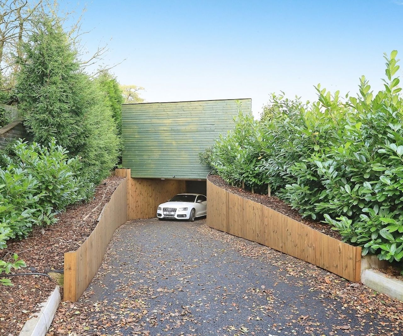 An underground garage led by a driveway