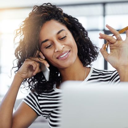 Woman talking on the phone and smiling