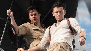 Mark Wahlberg stars as Victor “Sully” Sullivan and Tom Holland is Nathan Drake — both seen staring out of a helicopter —in Columbia Pictures' UNCHARTED