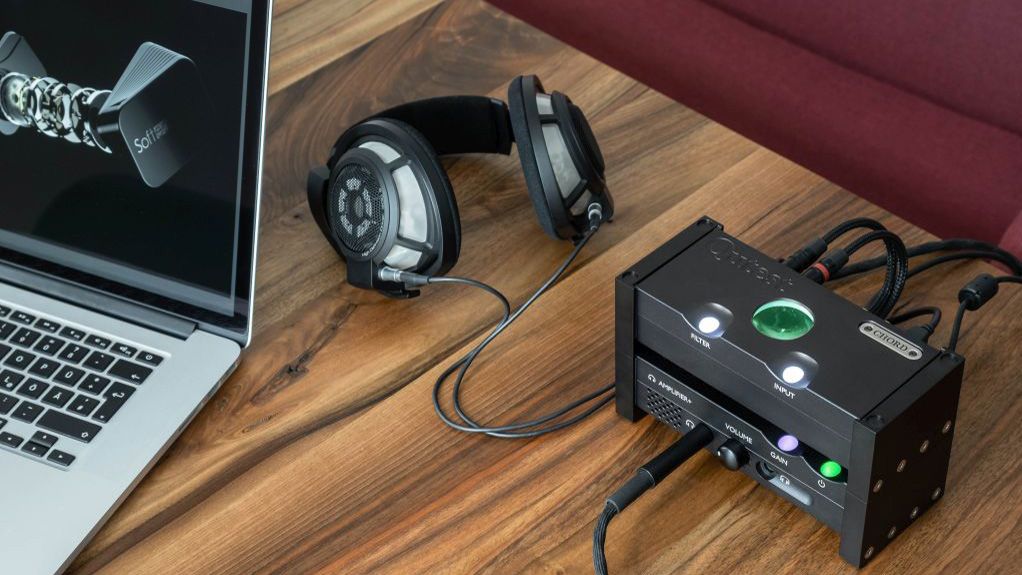 the chord anni headphones amp with a pair of headphones plugged in