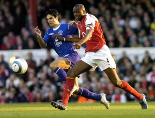 Patrick Vieira (right) in action against Mikel Arteta