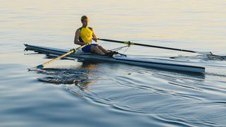 Low impact workouts: image shows rower in canoe